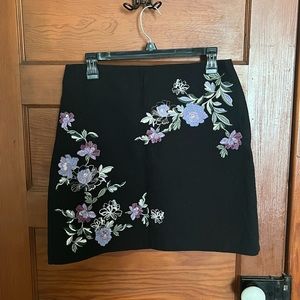 Loft mid-thigh length skirt. Size 6. Main color black with flower detailing